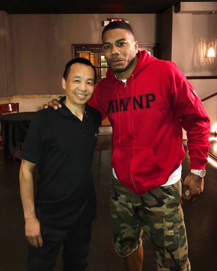 Nelly standing posing for the camera