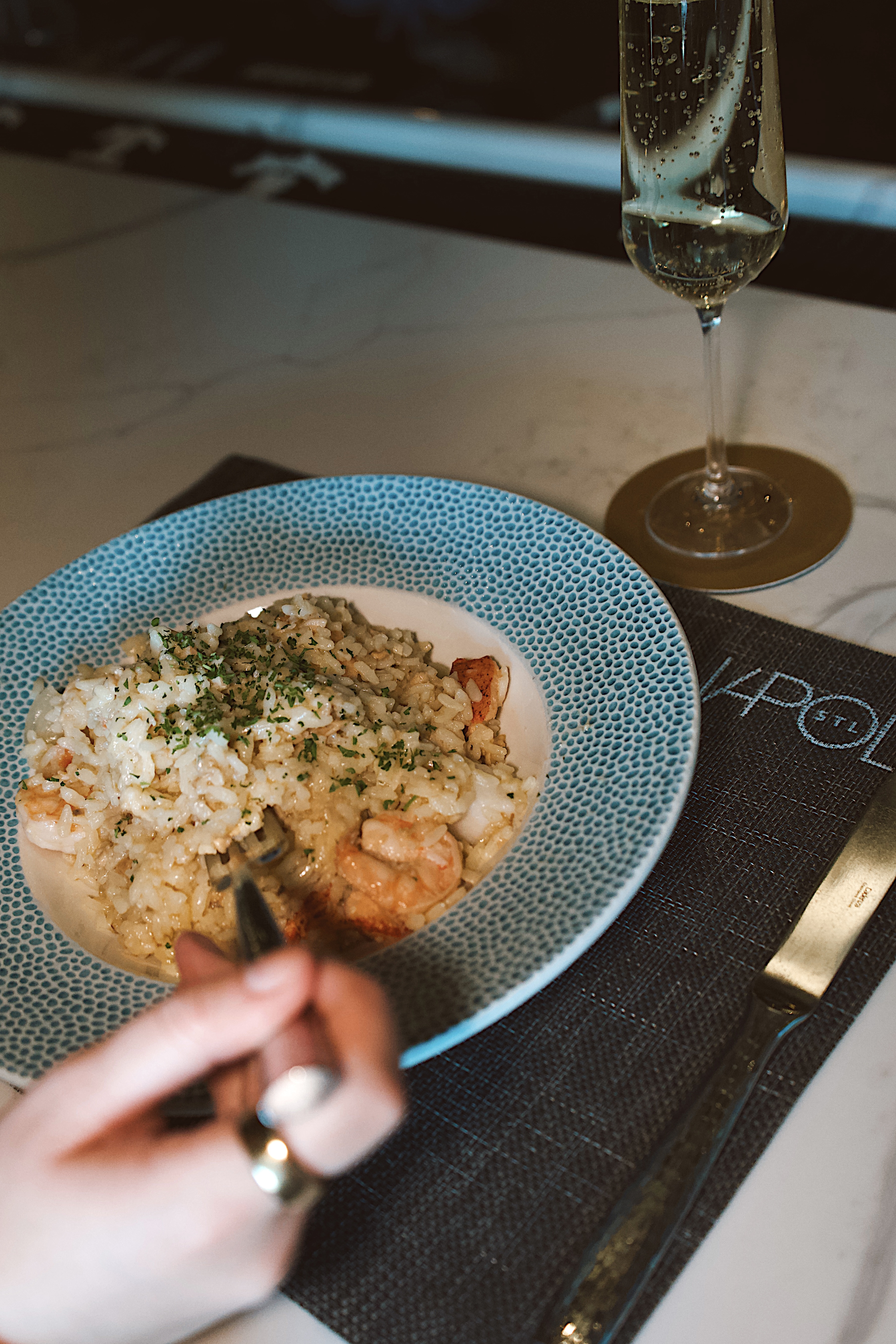 a plate of rice and shrimp with a fork