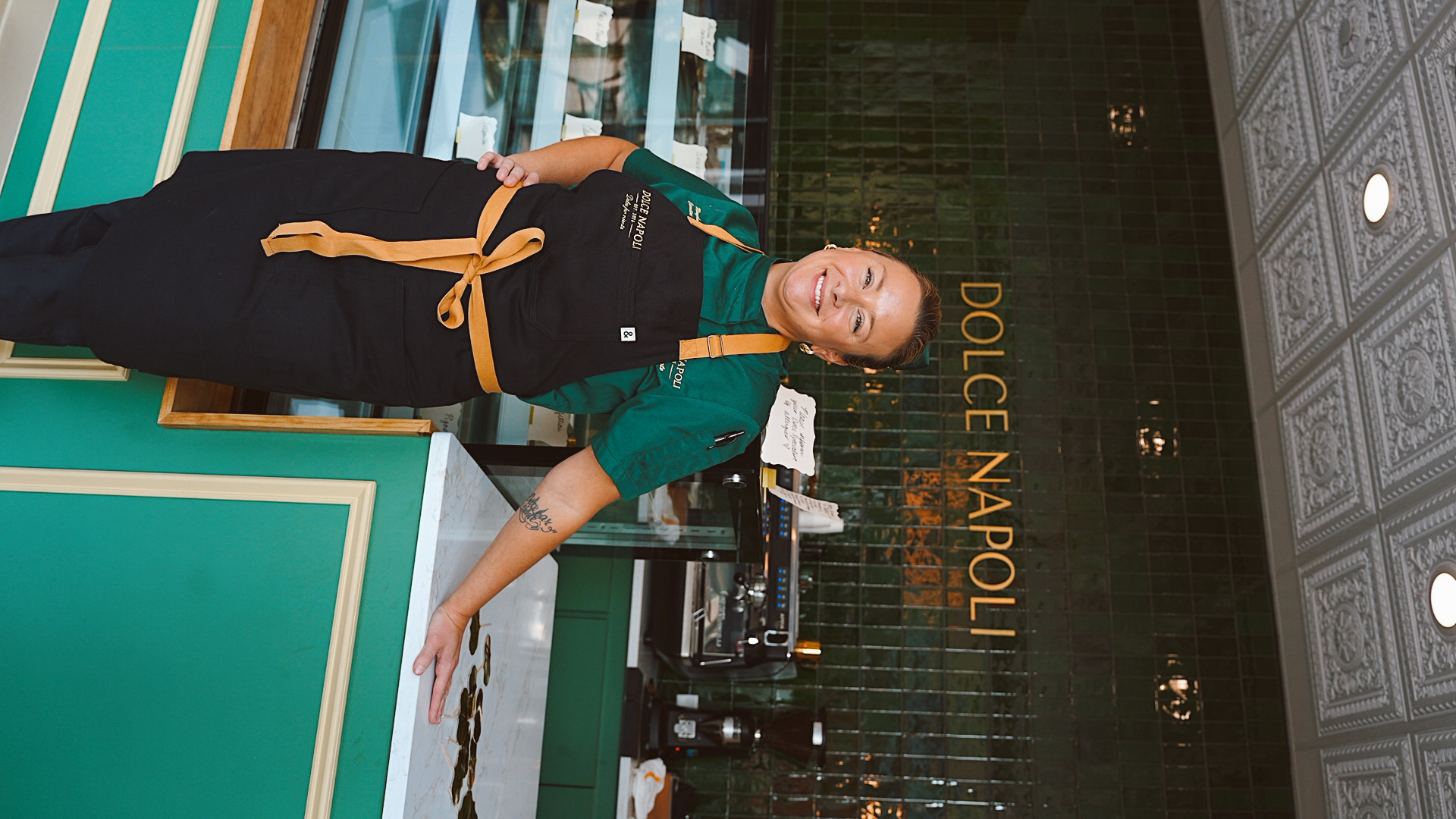 a woman standing in front of a counter