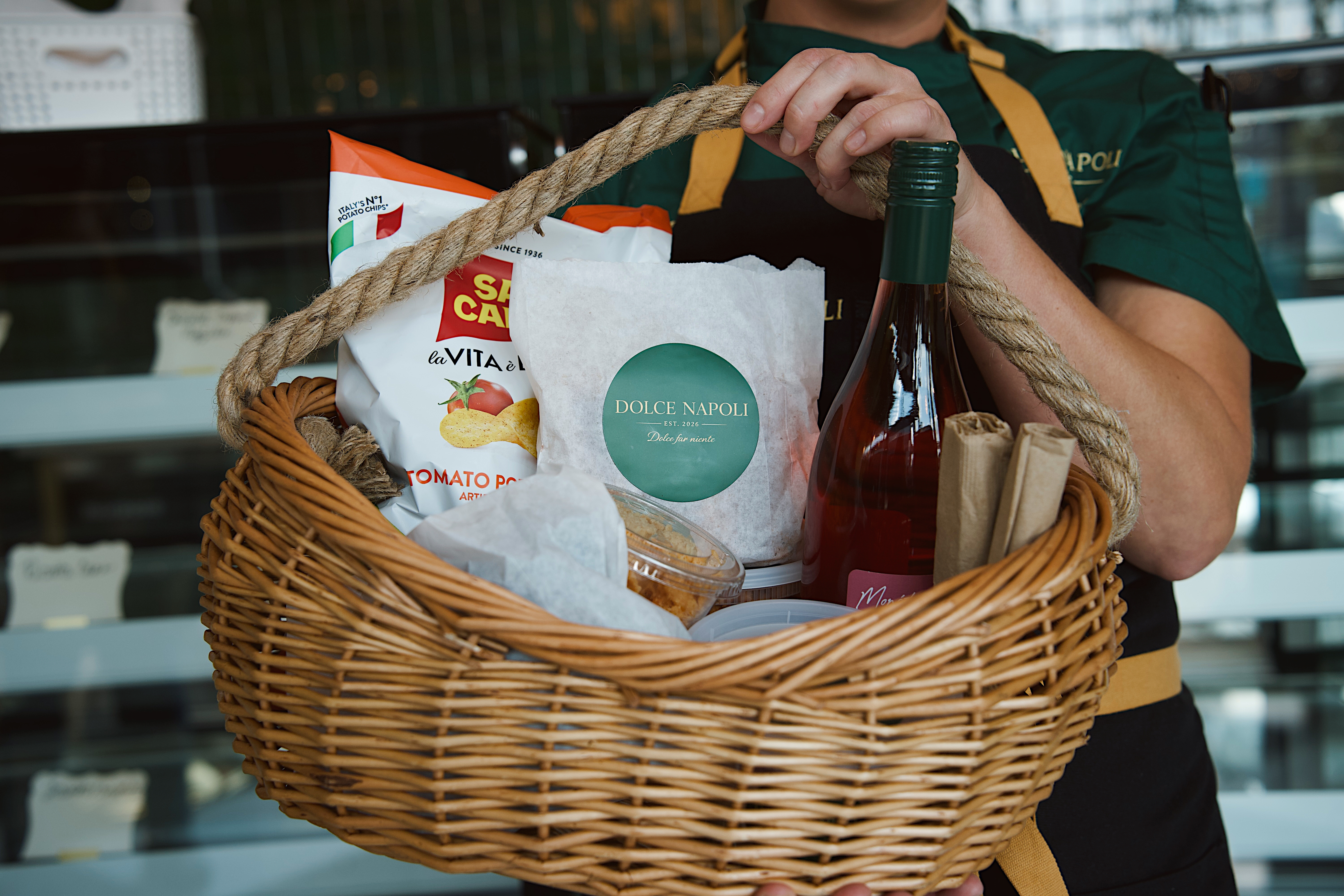 a person holding a basket of food