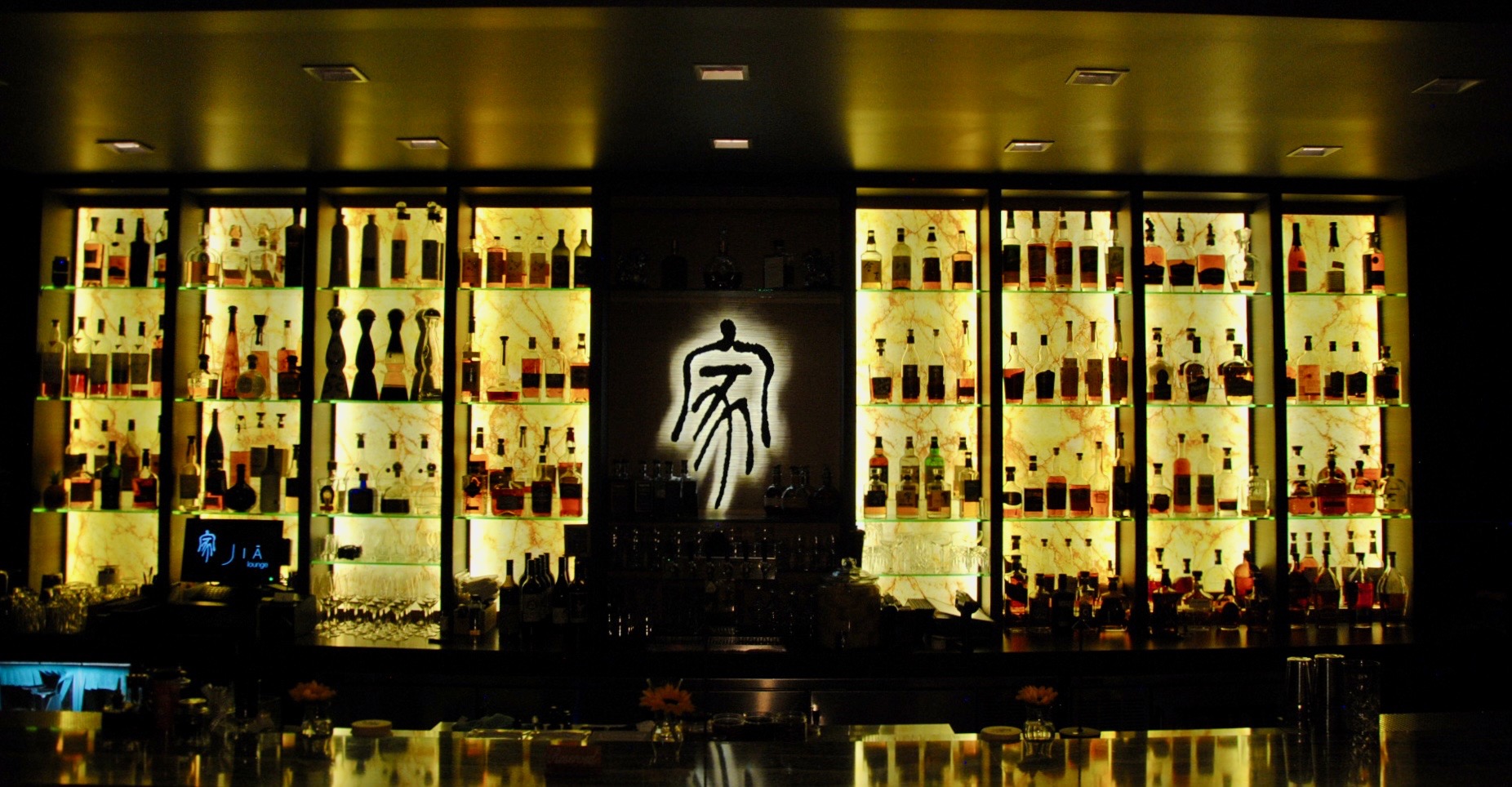 a bar with bottles of alcohol
