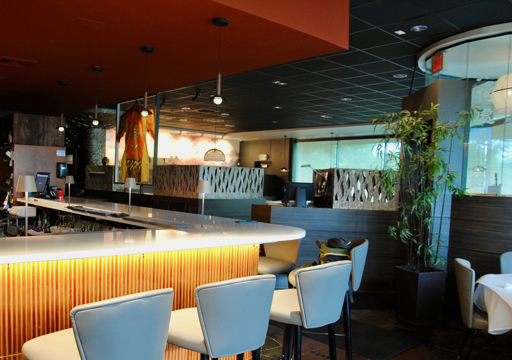 a bar with chairs in a restaurant