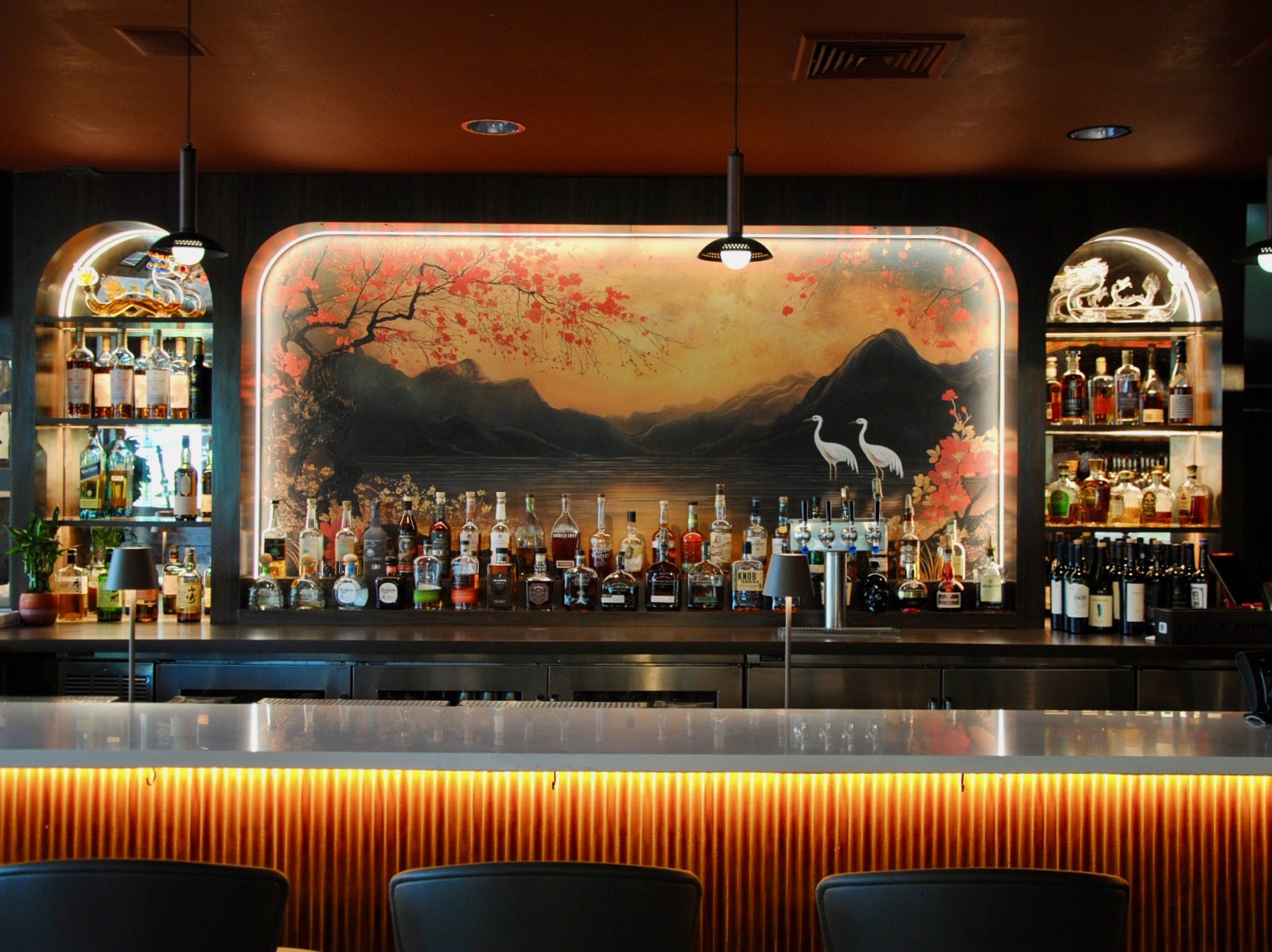 a bar with bottles of alcohol