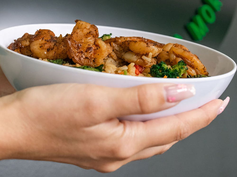 Woman holding shrimp salad