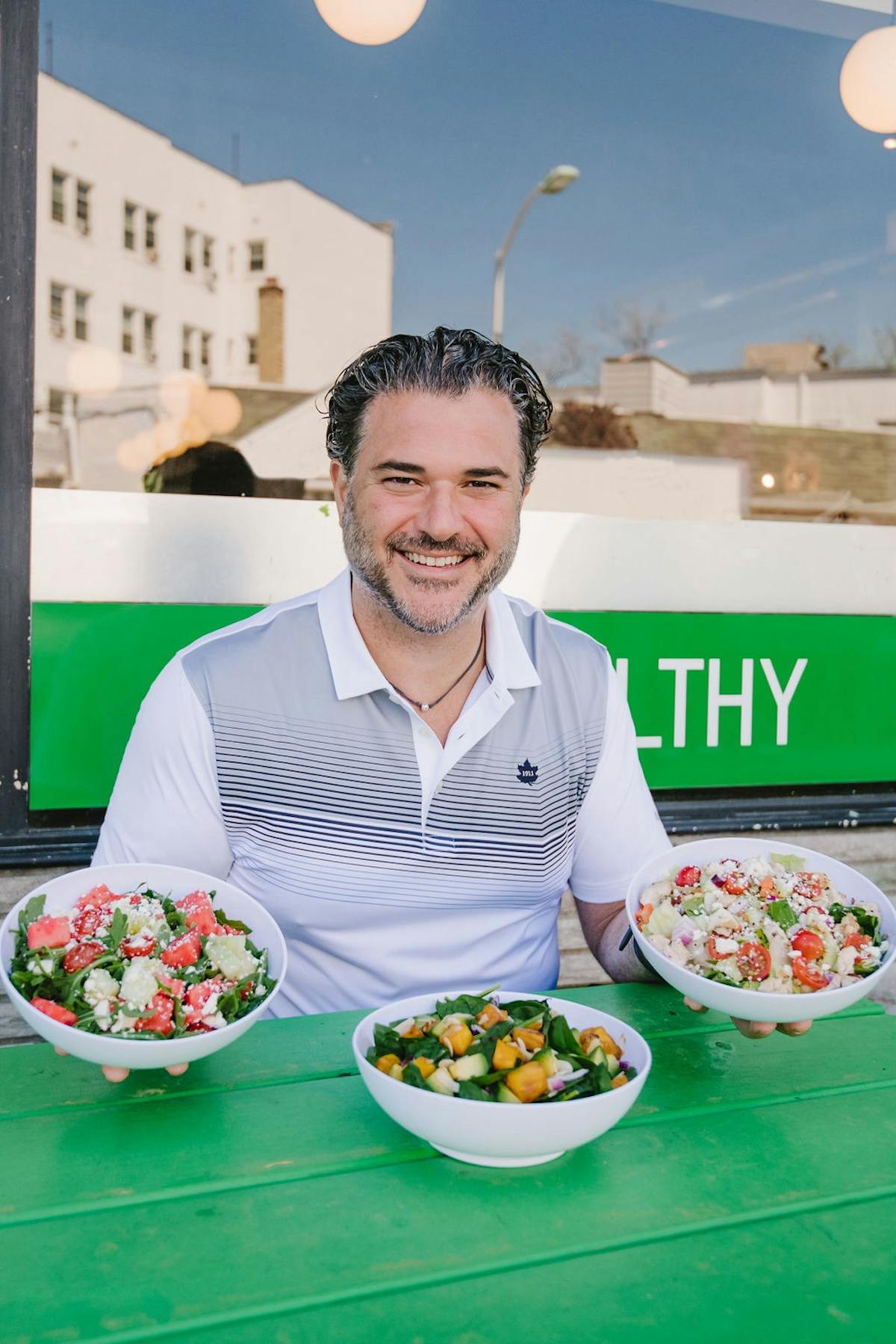 a man and a woman standing in front of a plate of food