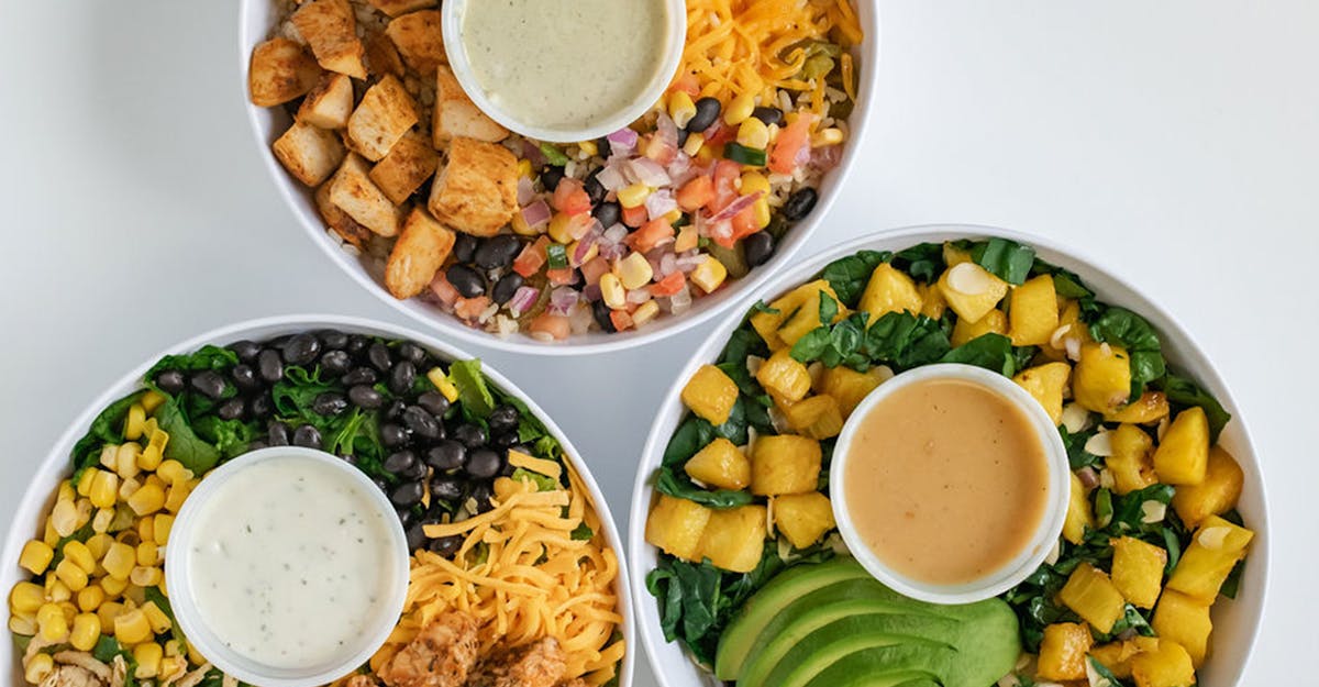 a bowl filled with different types of food on a plate