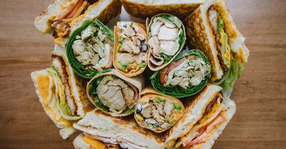 a sandwich sitting on top of a wooden table