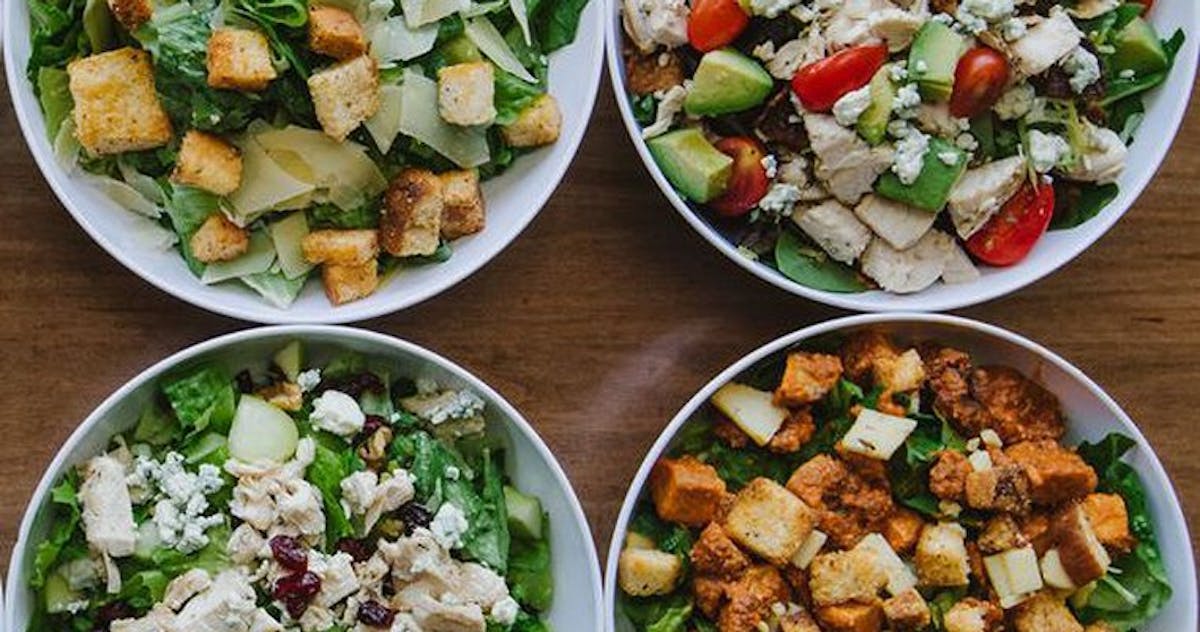 a plate is filled with different types of food on a table