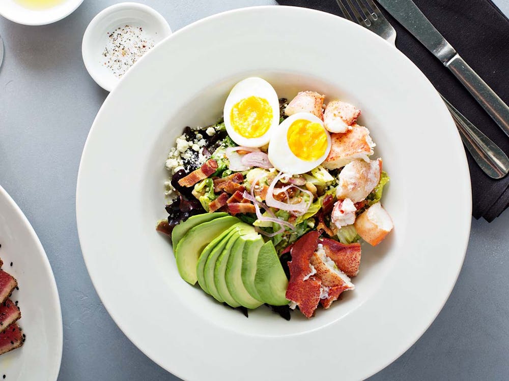 a box of food sitting on top of a wooden table