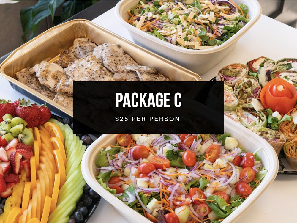 a box filled with different types of food on a table