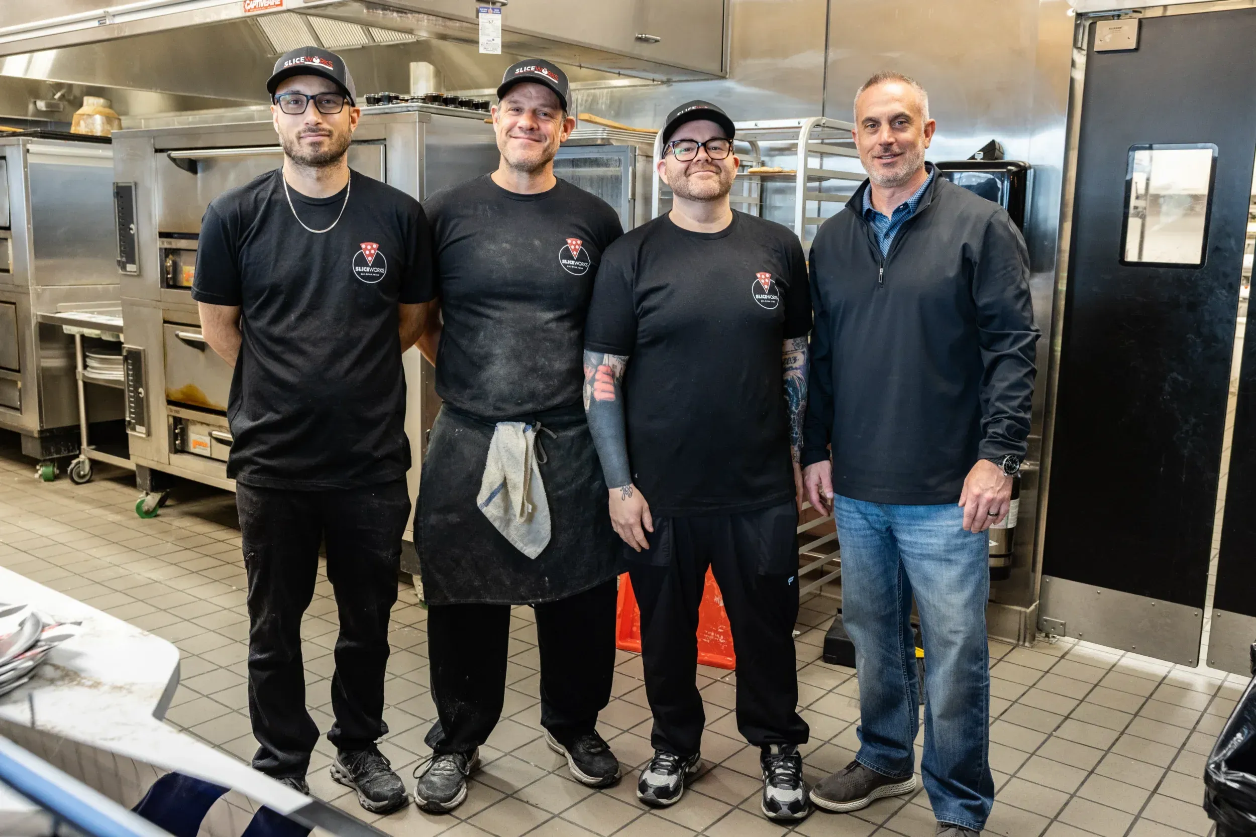 a group of men in black shirts