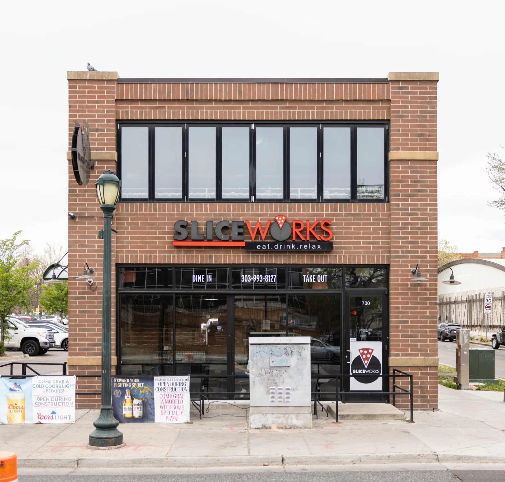 a brick building with a sign on the front