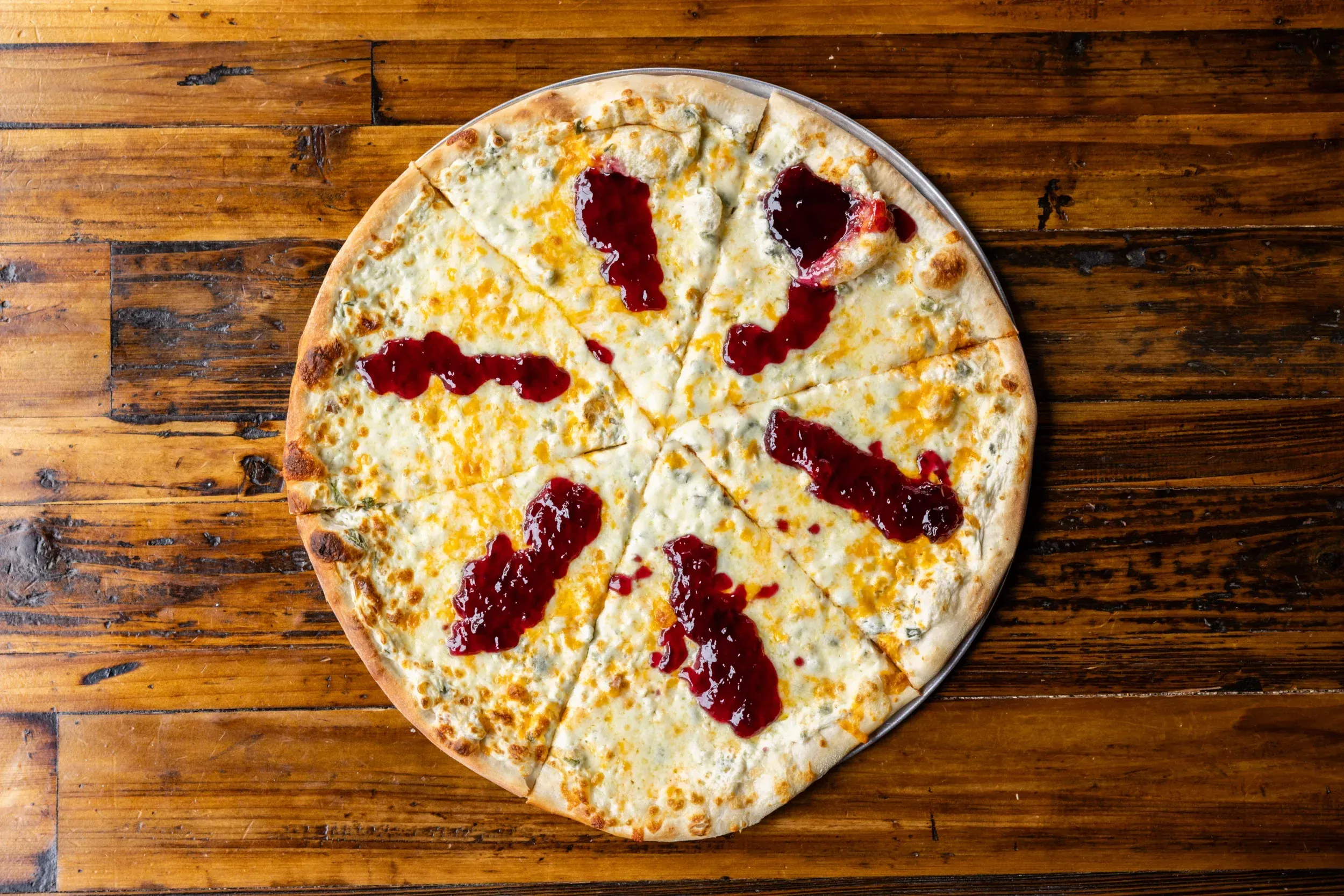 a pizza with jam on it