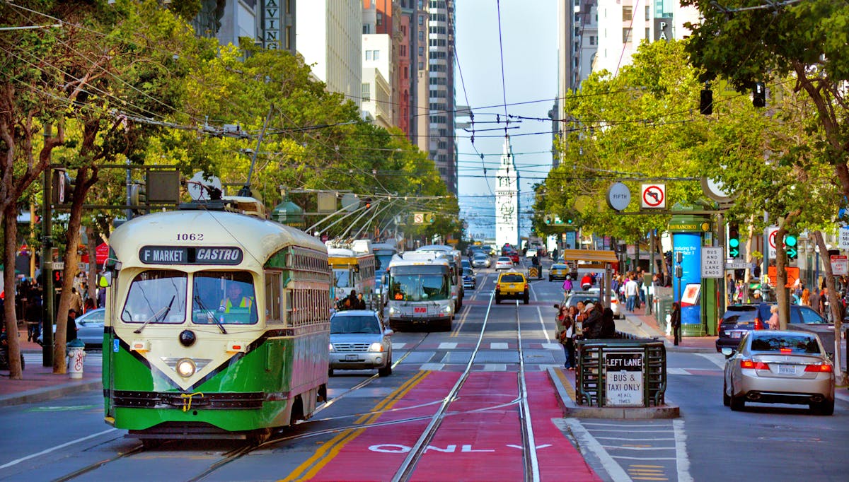 a bus driving down a busy city street