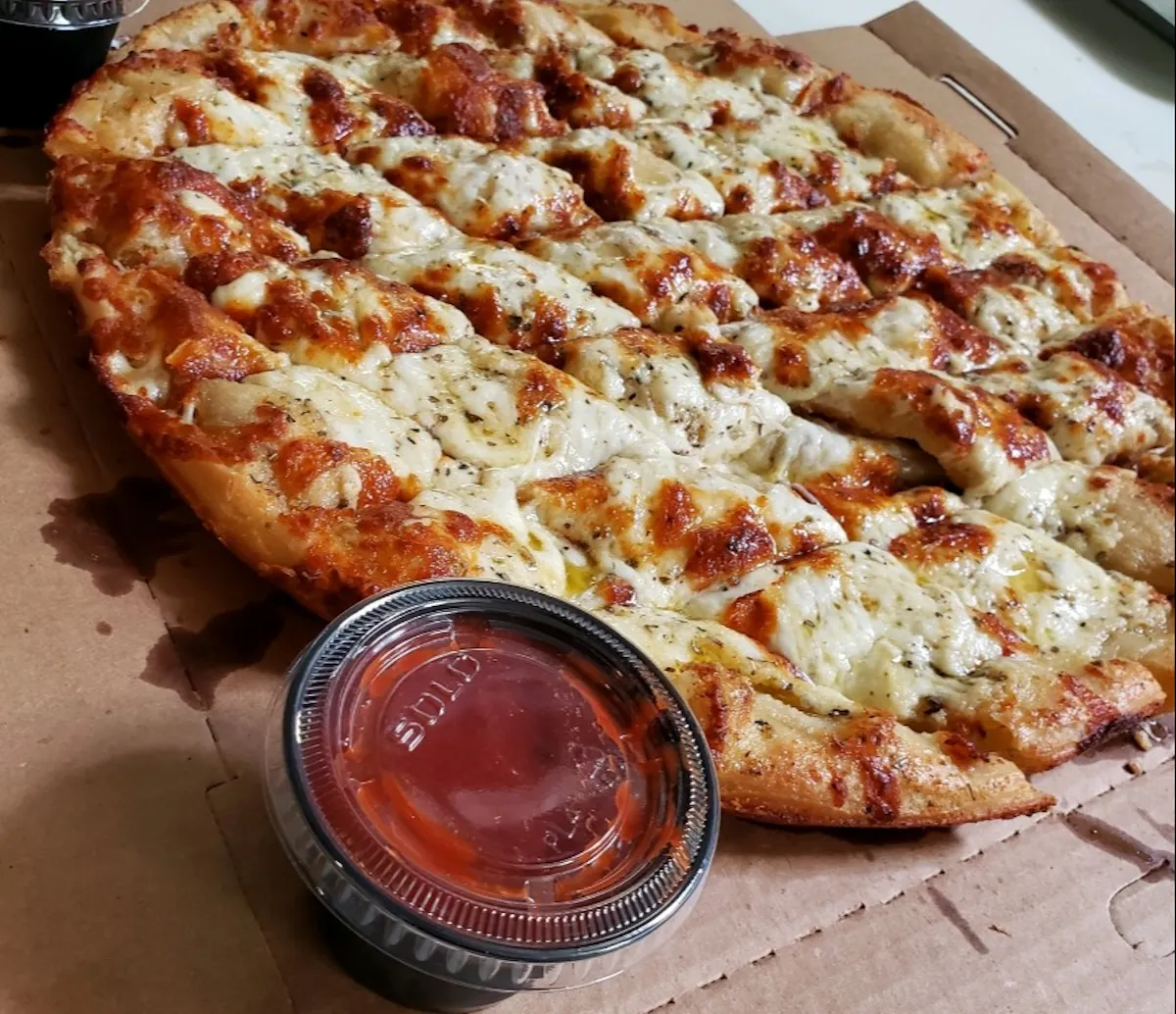 a close up of a slice of pizza