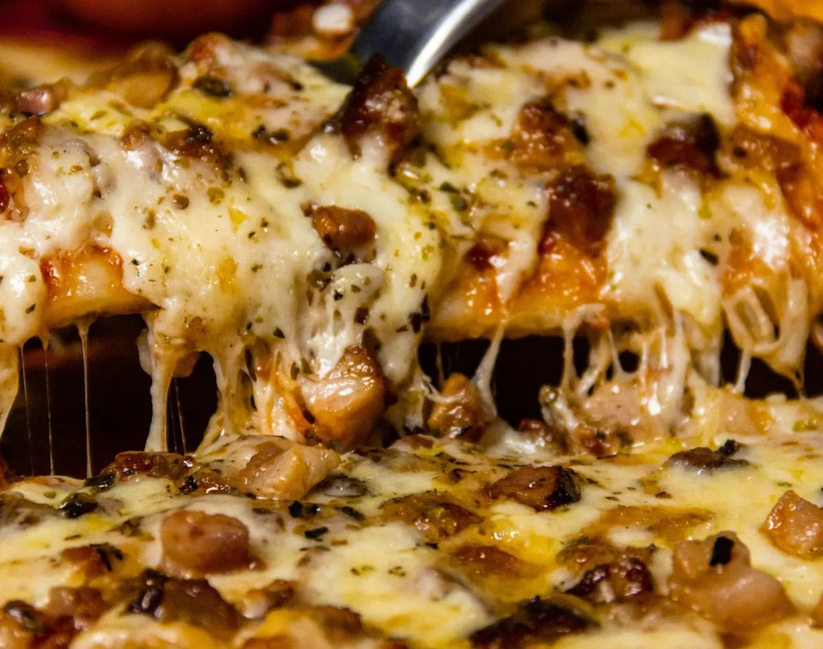 a close up of a slice of pizza
