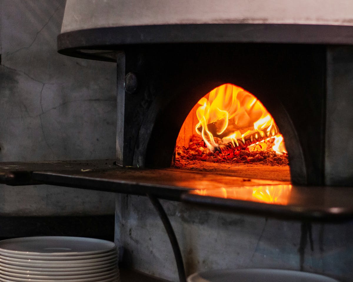 a fire place and a stove top oven sitting next to a fireplace