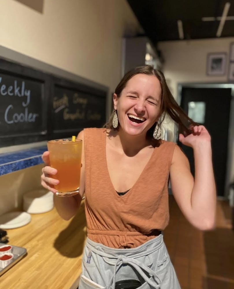 a woman holding a glass of wine