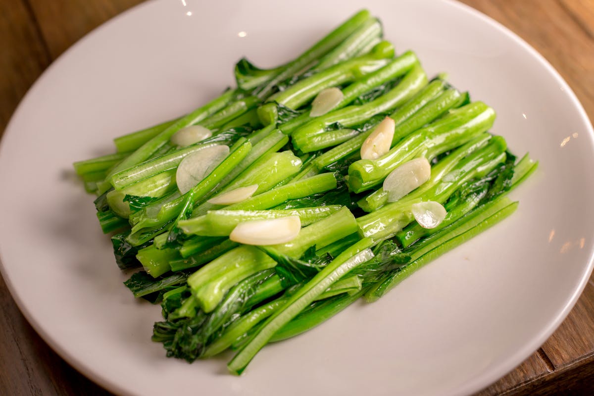 a white plate topped with a pile of chopped vegetables