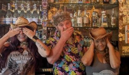 a man sitting in front of a store