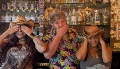 a man sitting in front of a store