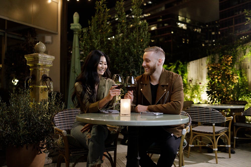 a man and a woman sitting at a table in a restaurant