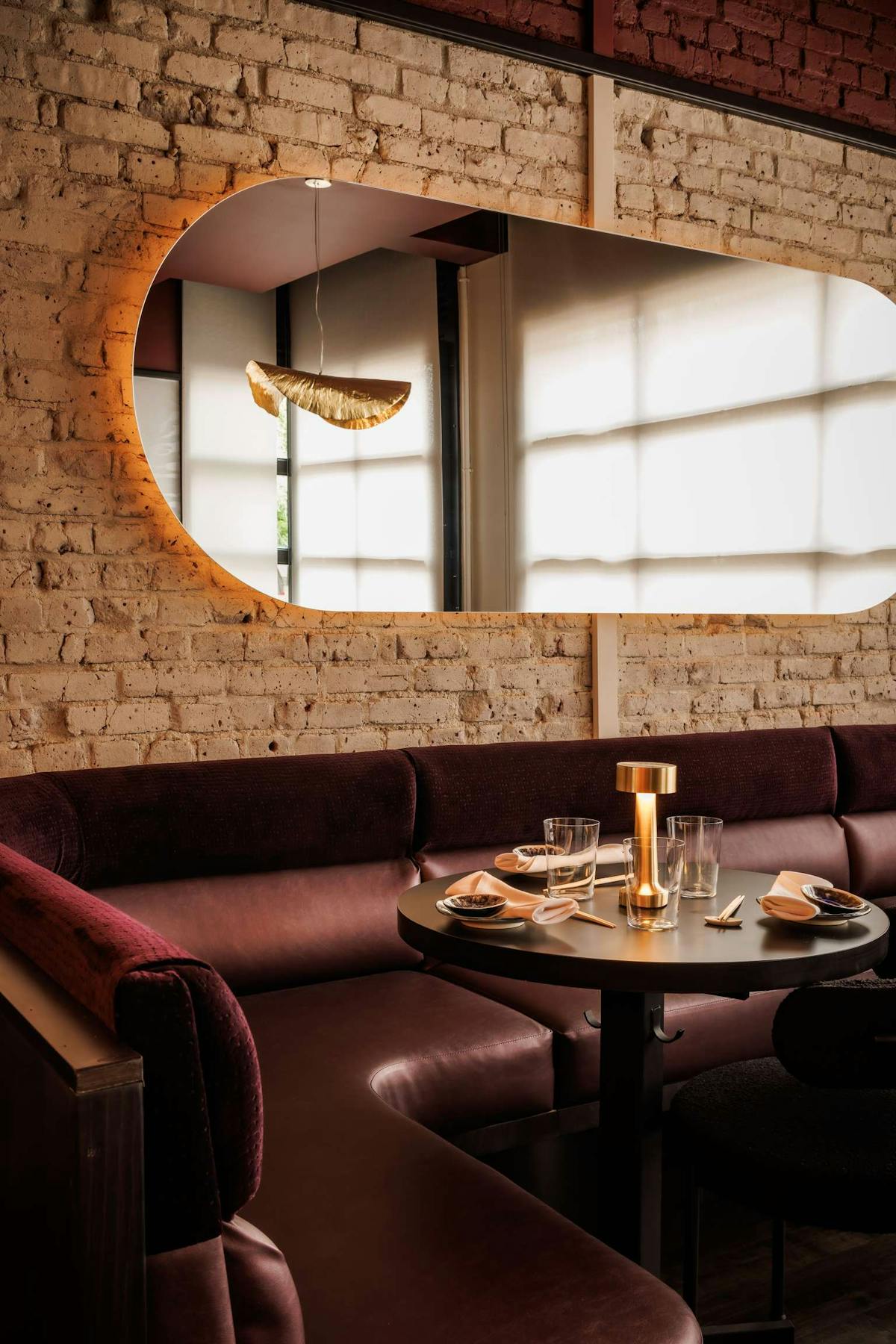 a room with a couch and a table in front of a window
