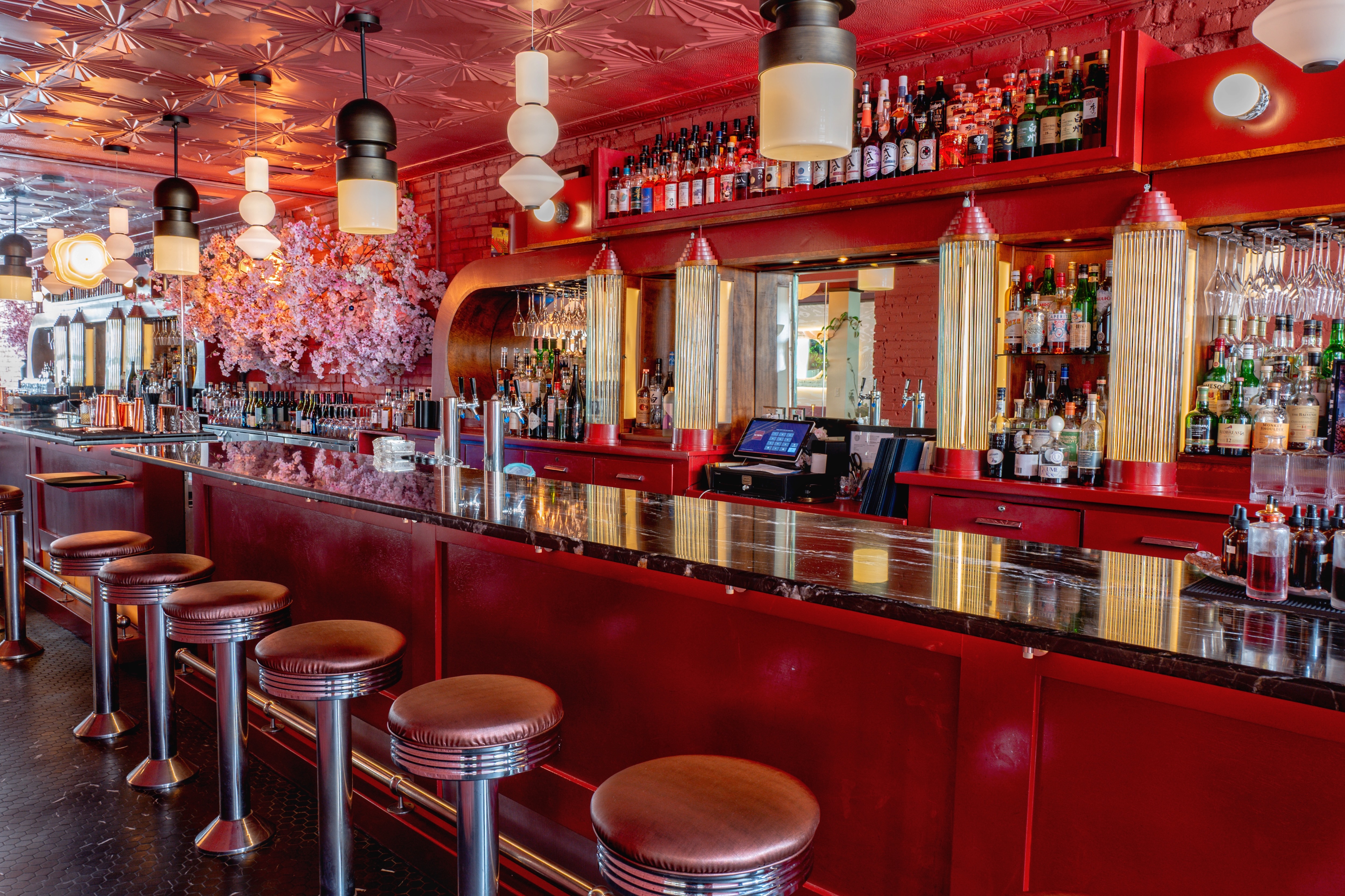 a bar with many bottles of alcohol