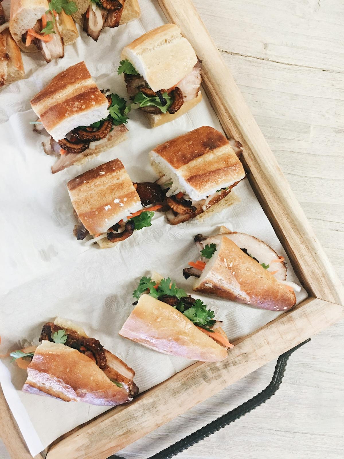 a cut in half sandwich sitting on top of a cutting board