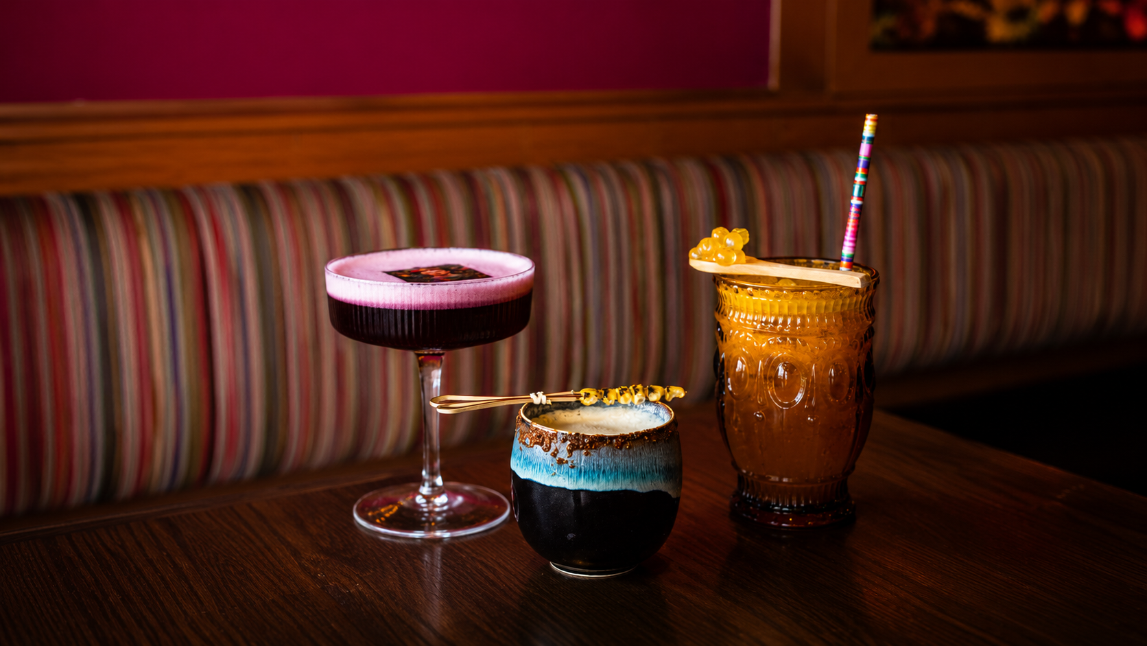Casa Felix cocktails and Mexican dishes arranged on a table for sharing.