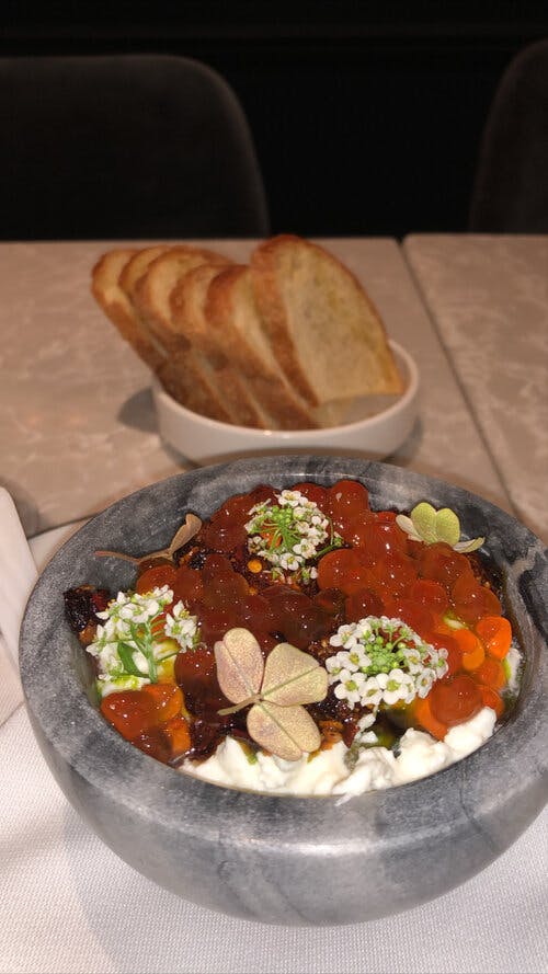 a bowl of food sitting on a table