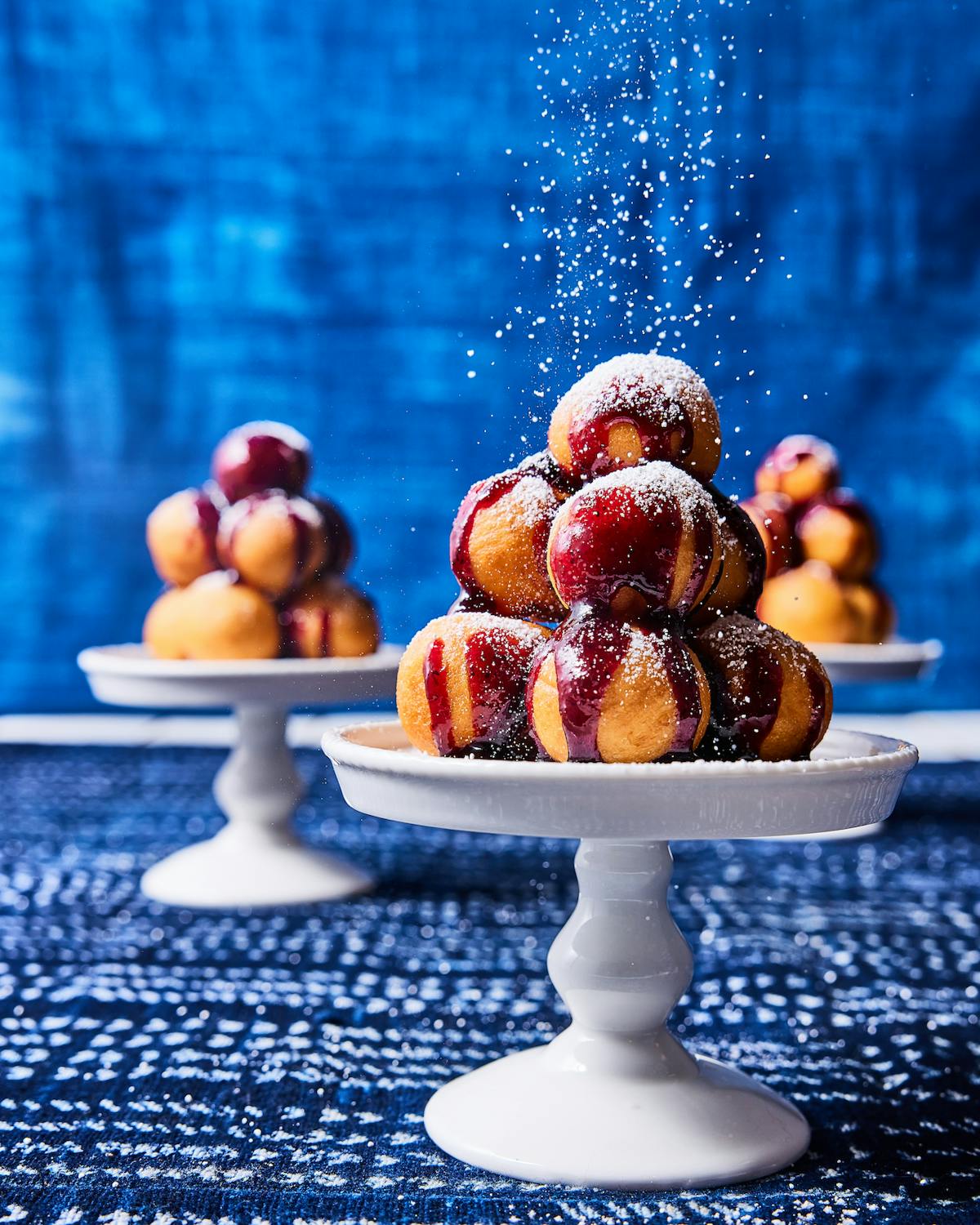 a plate of doughnut holes on a table