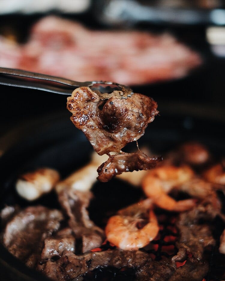 a close up of a piece of meat on a grill