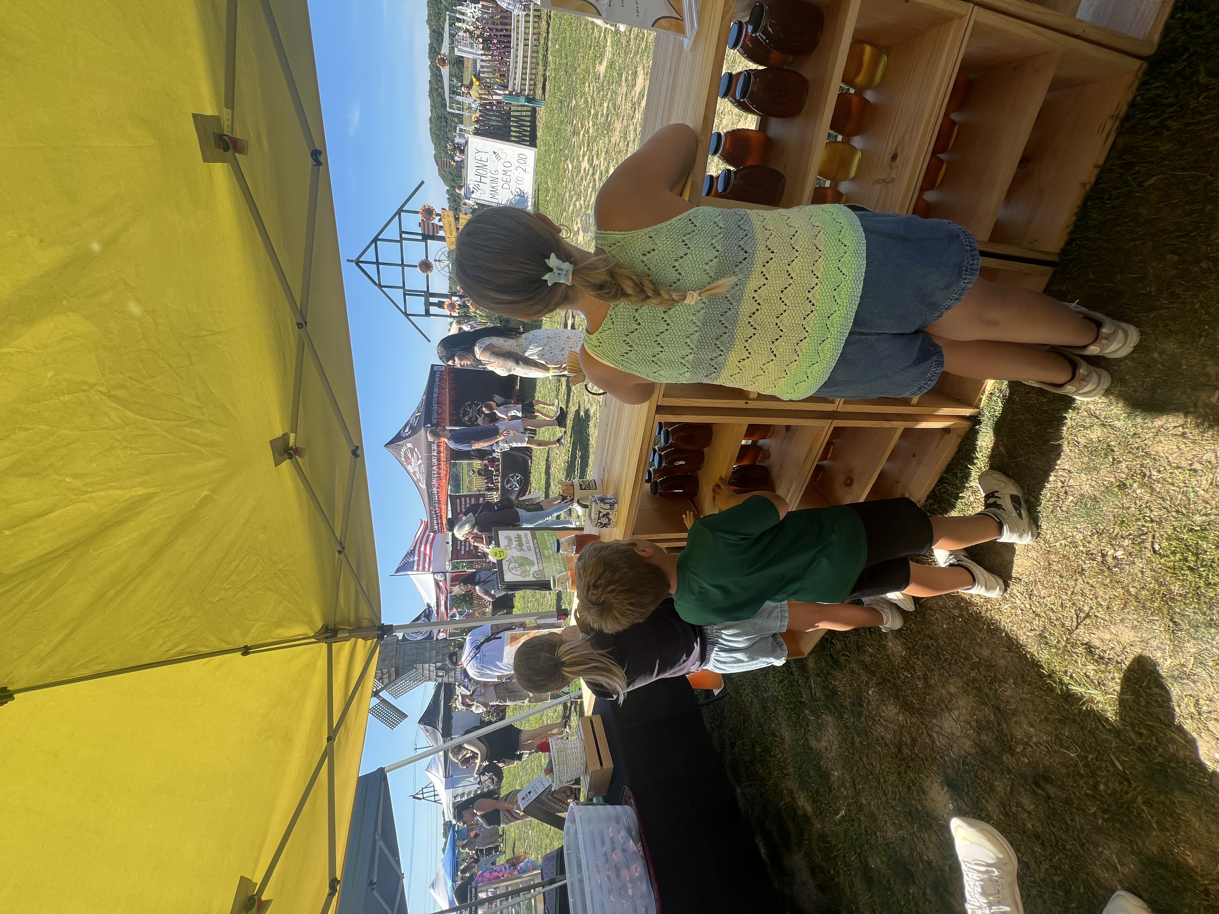 a group of people standing in the grass