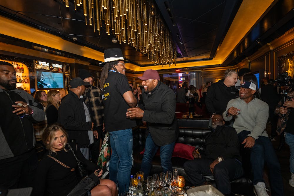 a group of people standing in a train station