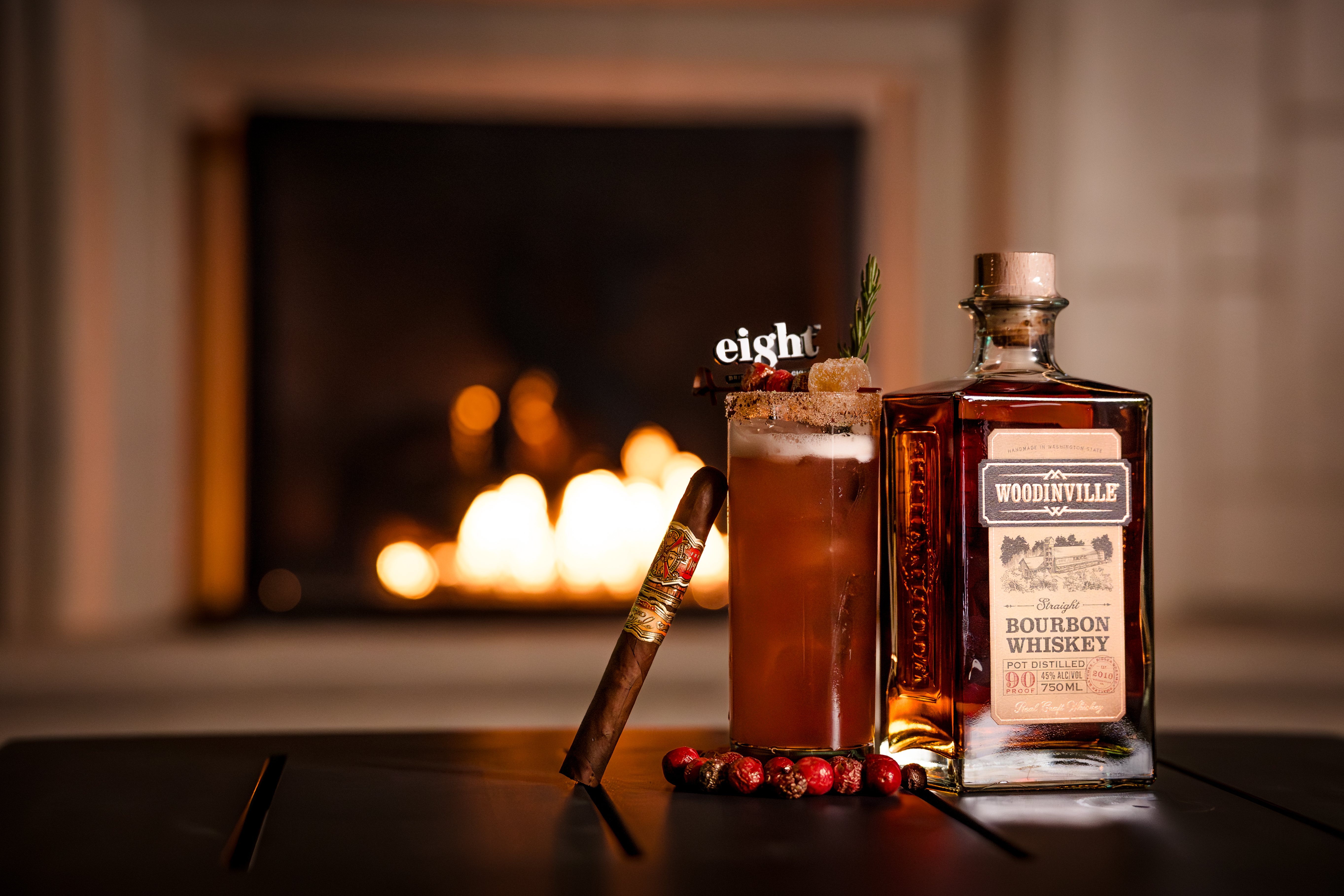a glass of wine sitting on top of a wooden table