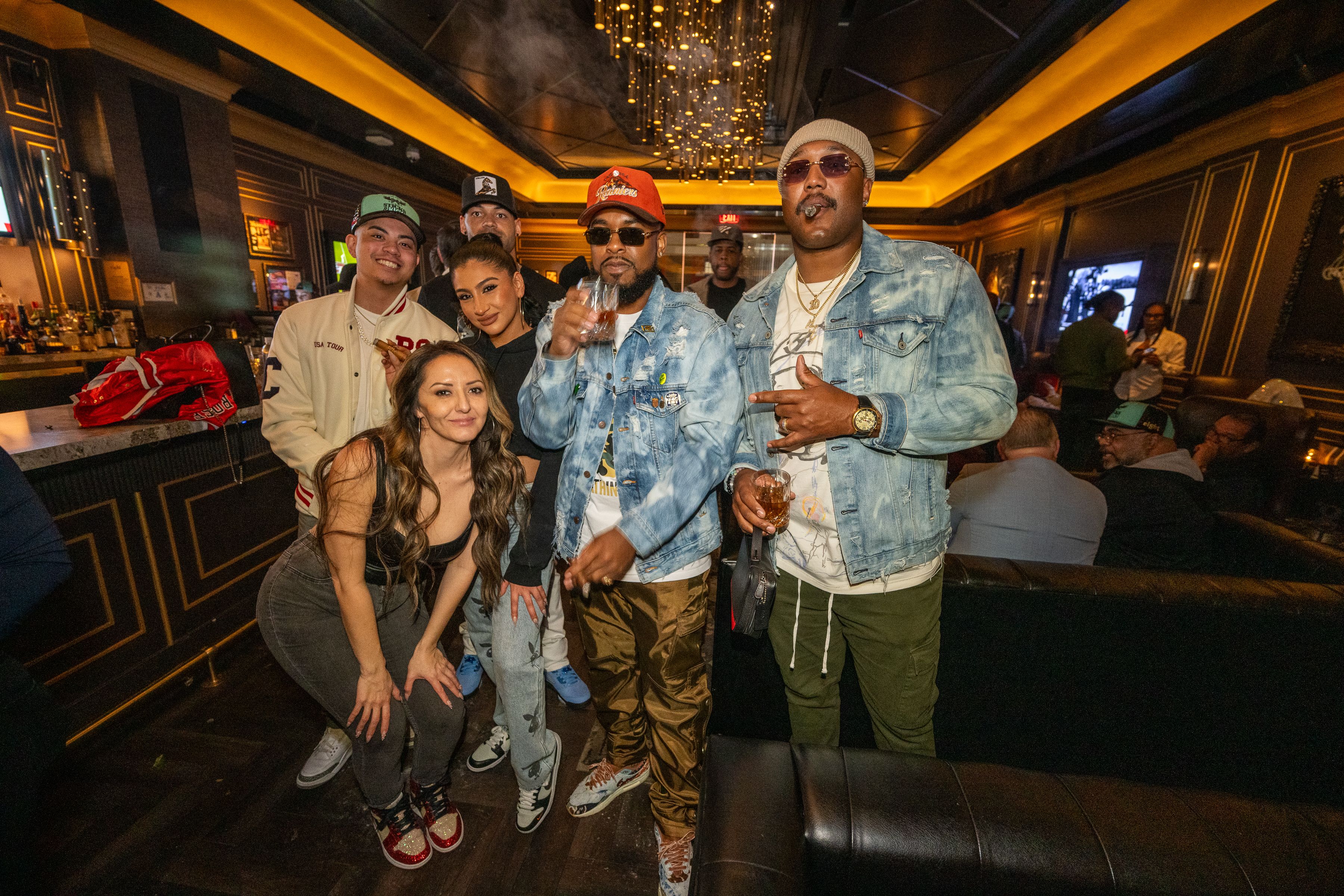 a group of people standing in front of a bus