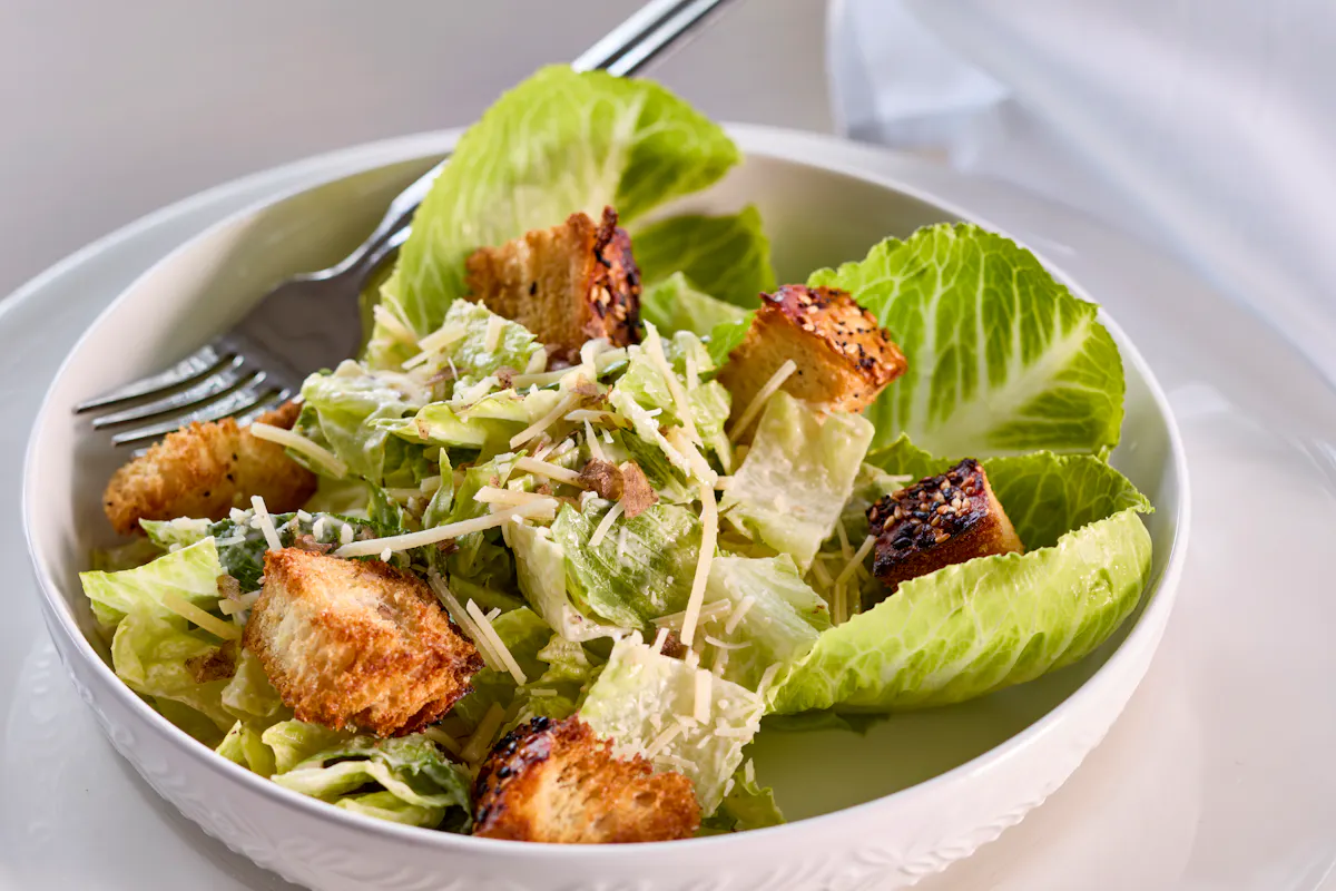 a bowl of salad on a plate