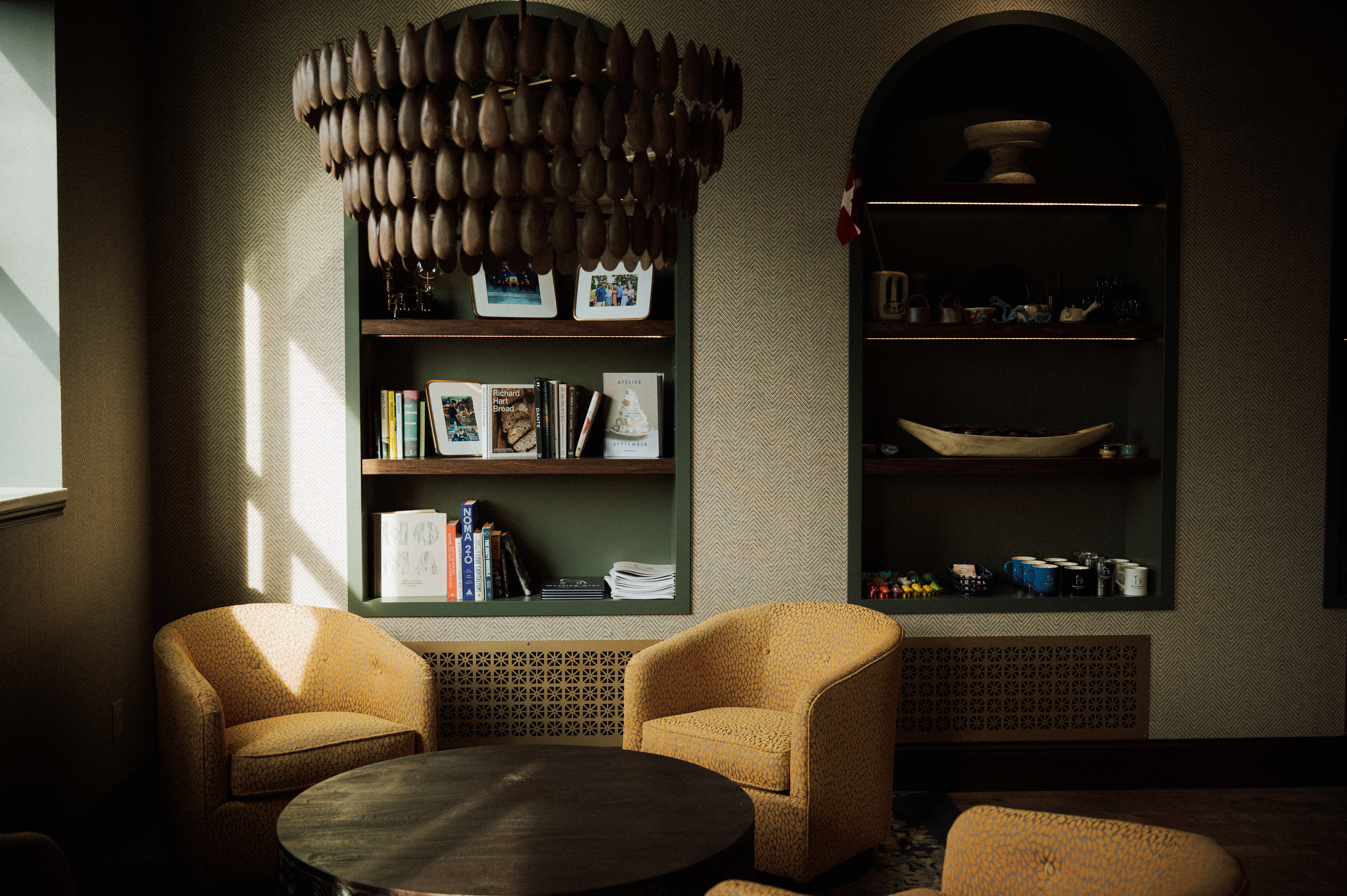 a room with a chandelier and chairs