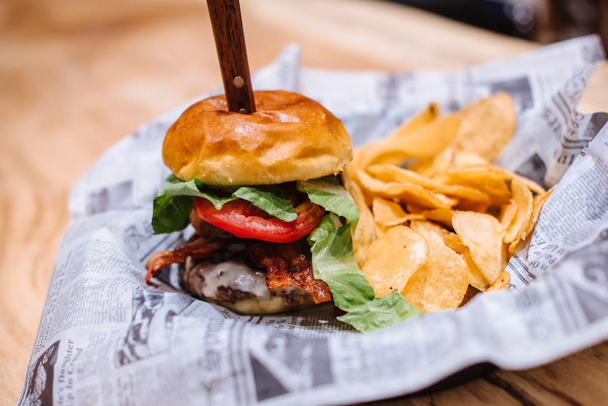 a sandwich sitting on top of a wooden table