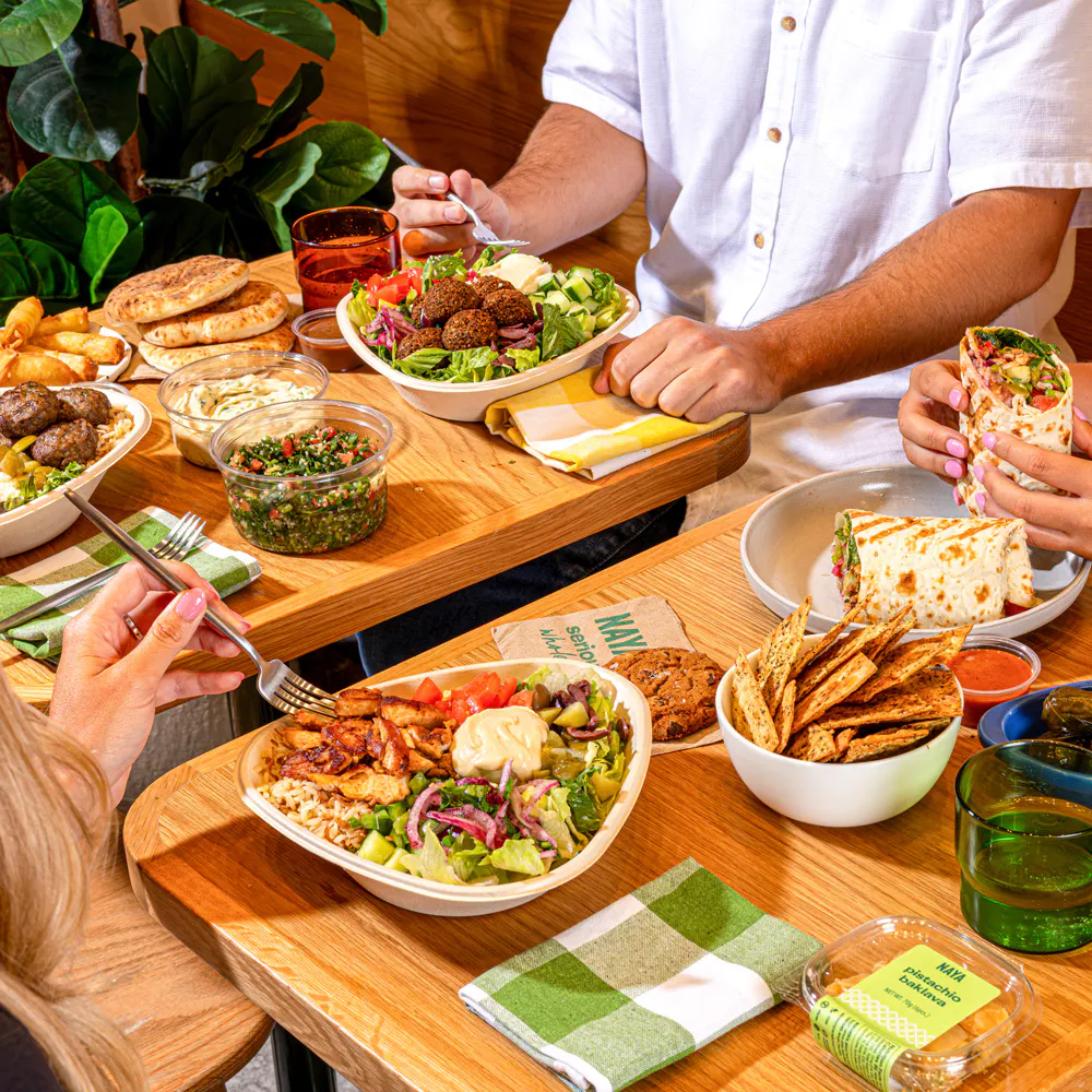 a group of people eating at a table