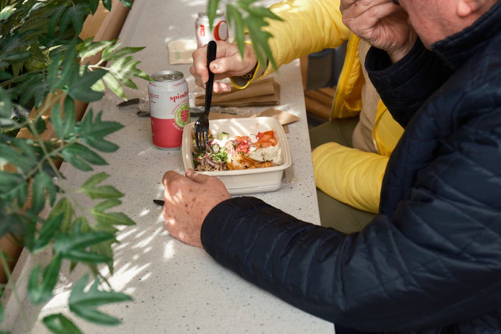 Person eating a Naya bowl. You could be eating antioxidant rich quinoa bowls at your local Naya. Naya now offers quinoa as a health forward bowl base. Get your quinoa bowl at NAYA NYC, NJ, CT, PA