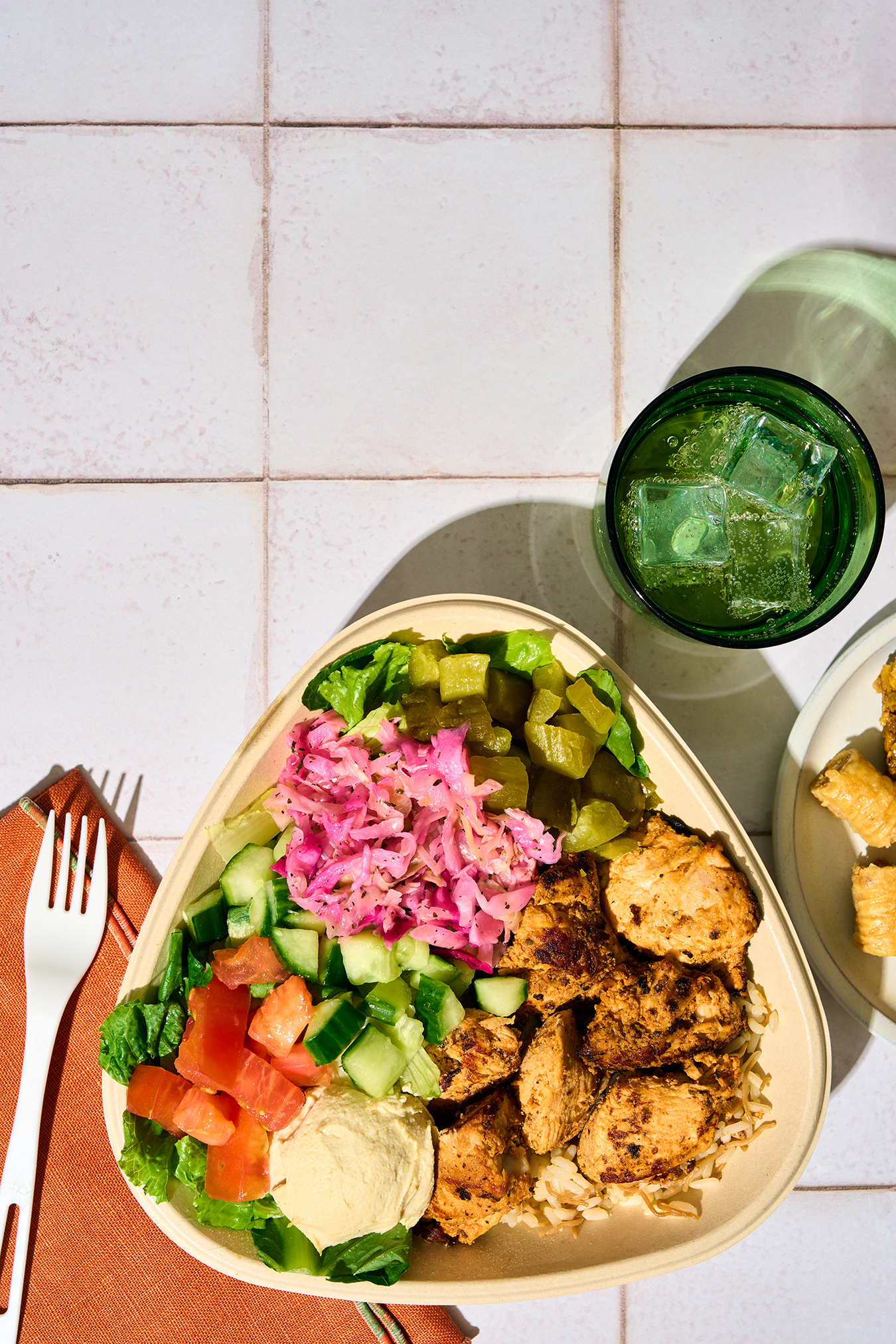 a Naya chicken kebab bowl on a title table
