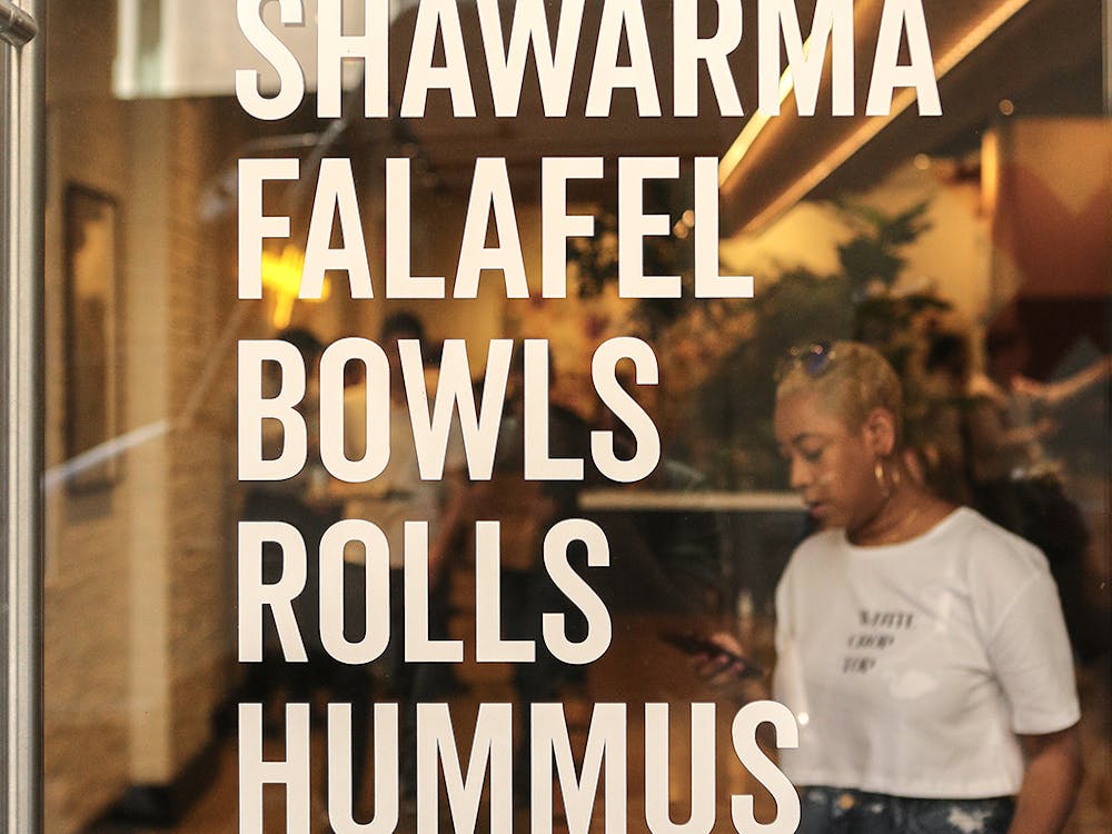 a person standing in front of a sign