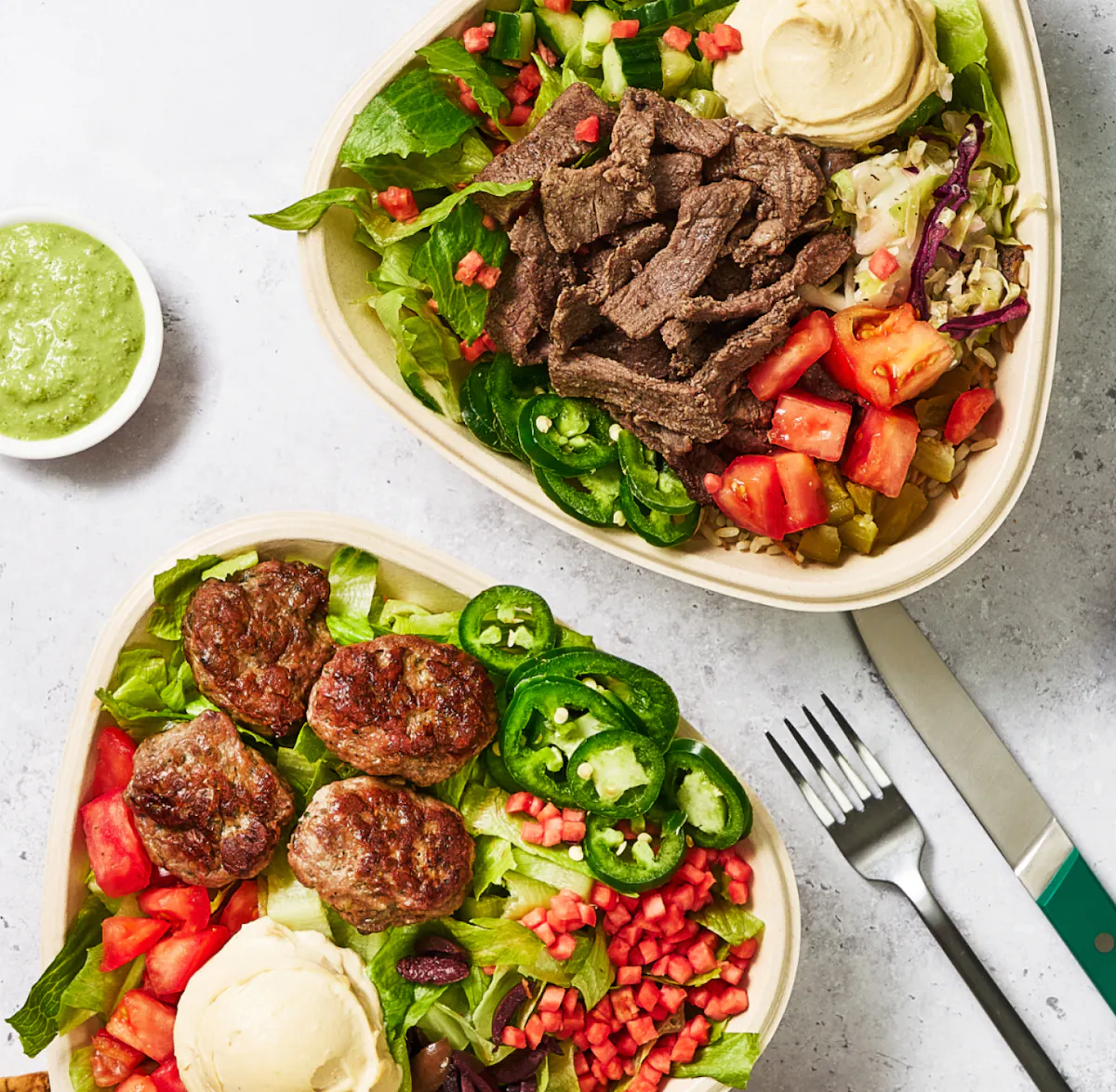 a bowl of salad with meat and vegetables