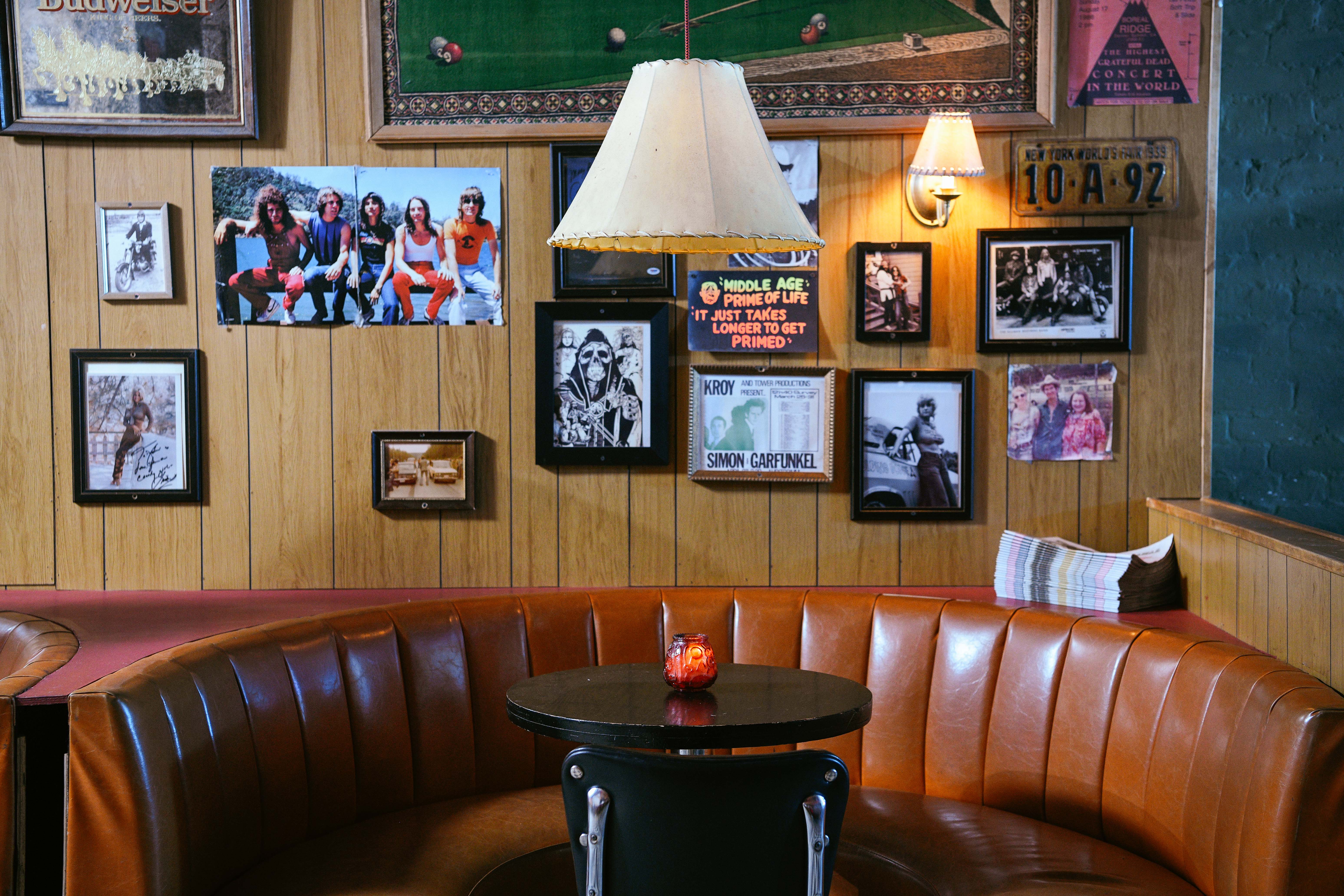 a room with a couch a table and chairs