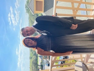 a person standing in front of a fence