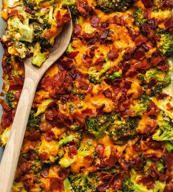 a pizza sitting on top of broccoli