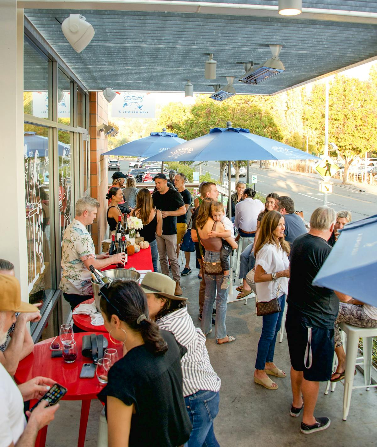 a group of meat cute guests enjoying wine on the loveski napa patio