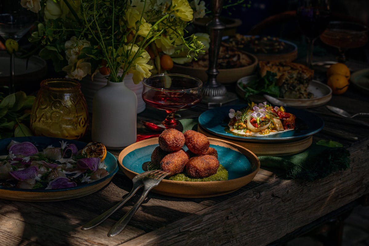 Various dishes from Hadeem restaurant, shot in a moody style.